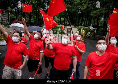 Pro-Beijing supporters waving Chinese flags during a pro CCP rally.1st of July marks the 100th anniversary of the founding of the CCP (Chinese Communist Party) and the 24th anniversary of Hong Kong's handover to China. CCP supporters took to the street to celebrate while pro democracy Hong Kong protestors also march through the capital city to express their politic stands. (Photo by Viola Kam / SOPA Images/Sipa USA) Stock Photo
