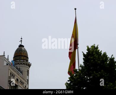 Mosaic decorated cupola on the 1929 former headquarters building of Banco Zaragozano now used by Caixa Bank and Spanish flag Zaragoza Aragon Spain Stock Photo