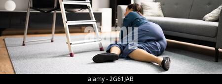 Clumsy Women Falling Ladder Incident. Injured Person On Floor Stock Photo