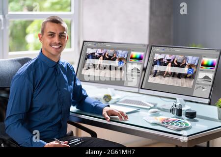 Graphic Web Designer Artist Using Computer To Design Stock Photo