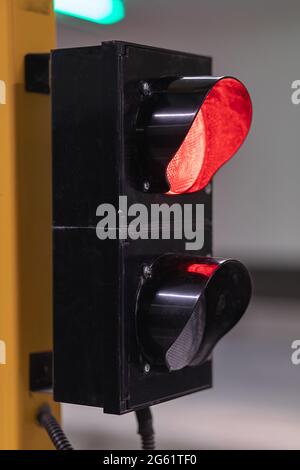 Closeup shot of a traffic light with the red signal light on in front ...