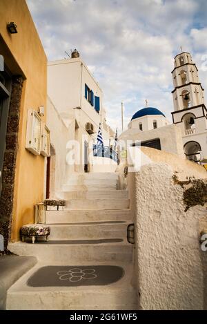 Bell tower and dome of Agios Nikolas Church in the medieval hilltop village of Pyrgos on the Greek Island of Santorini. Stock Photo