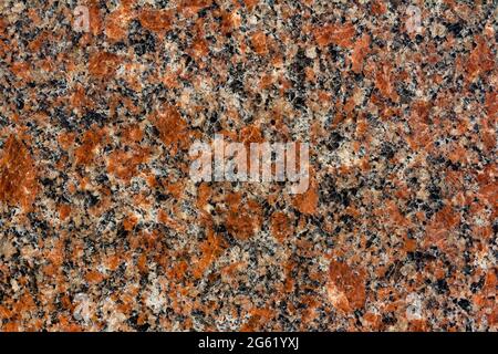 Texture photo of red toned marble stone pattern close-up view. Stock Photo