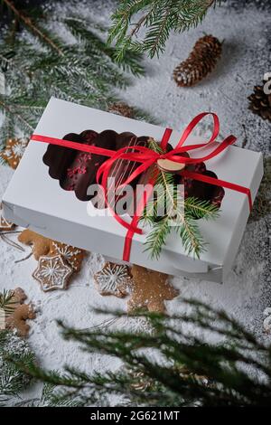 Classic French eclair with custard in chocolate glaze. Dessert is decorated with freeze-dried raspberries and strawberry chocolate. Delicious and beau Stock Photo