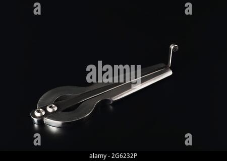 Harp compass on a dark background. Stock Photo