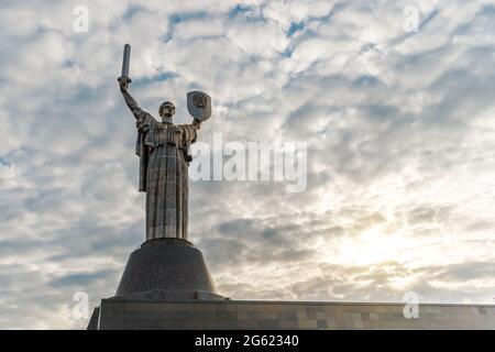 Kiev, Ukraine - April 26, 2021: View of the Monument Motherland in Kiev, Ukraine during sunset. Stock Photo