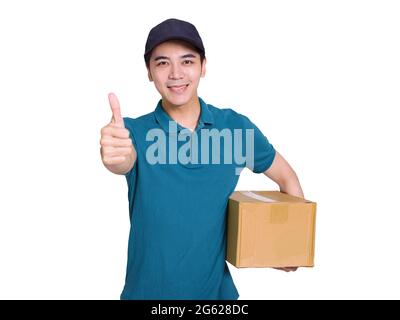 Young  delivery man holding carton package and showing thumbs up Stock Photo