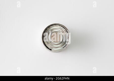 opened tin can on the table without leftovers from the food, meal concervation Stock Photo