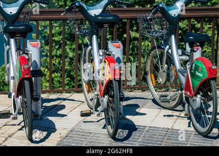 Seville Spain July 01, 2021 Accessible bicycles to hire for short periods of time, usually for a few hours parked in the street and part of the public Stock Photo