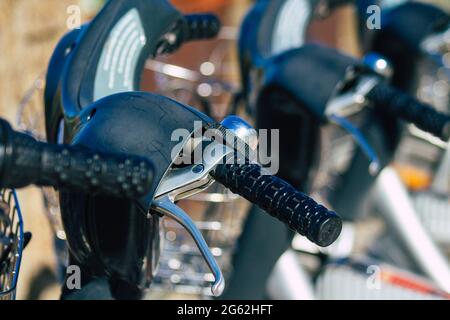 Seville Spain July 01, 2021 Accessible bicycles to hire for short periods of time, usually for a few hours parked in the street and part of the public Stock Photo