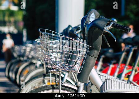 Seville Spain July 01, 2021 Accessible bicycles to hire for short periods of time, usually for a few hours parked in the street and part of the public Stock Photo