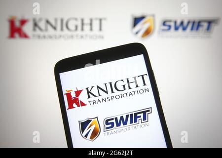 Ukraine. 01st July, 2021. In this photo illustration a Knight-Swift (Knight-Swift Transportation Holdings) logo is seen on a smartphone and a pc screen. (Photo by Pavlo Gonchar/SOPA Images/Sipa USA) Credit: Sipa USA/Alamy Live News Stock Photo