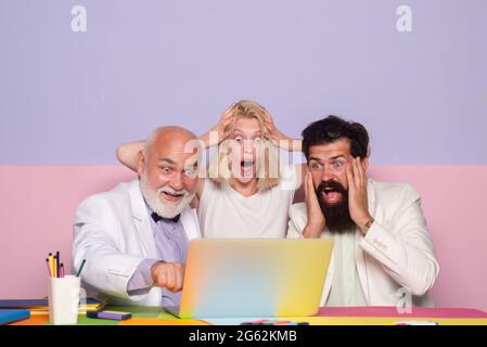Surprised business people working as a team at the office. Shocked group of business people. Businesspeople sharing their ideas. Shocked Business team Stock Photo