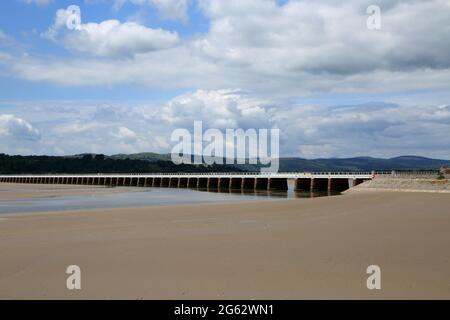 View of Kent Viaduct railway line over the tidal Kent river flowing into Morecambe Bay from The Promenade at Arnside, Cumbria, England, United Kingdom Stock Photo