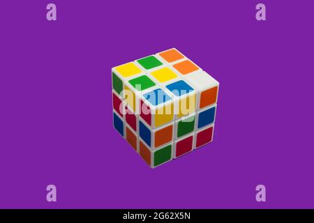 Rubiks Cube on a purple background isolated Stock Photo