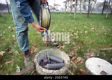 - the Park of the Oaks (Seveso, Lombardy, Italy), realized covering the area polluted by dioxin after the ecological disaster of Seveso in the june of 1976; sampling to check basins containing contaminated waste  - il Parco delle Quercie, realizzato coprendo la zona inquinata dalla diossina dopo il disastro ecologico di Seveso nel giugno del 1976; prelievo di campioni per il controllo delle vasche che contengono i rifiuti contaminati Stock Photo