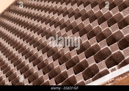 Abstract checkered grid exterior wall pattern with perspective. Selective focus. Diagonal lines. Selective focus Stock Photo