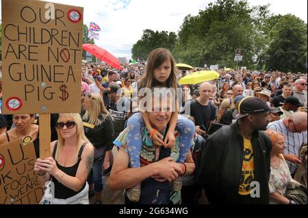 London, UK. 26th June, 2021. Protesters hold placards during the demonstration.Anti-lockdown and anti-vaccination demonstrators held a protest against further lockdowns, masks and vaccination passports. Credit: Martin Pope/SOPA Images/ZUMA Wire/Alamy Live News Stock Photo