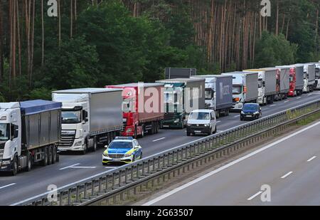 Jacobsdorf, Germany. 02nd July, 2021. Trucks are parked bumper to bumper on the eastbound A12 motorway about 15 kilometres from the German-Polish border crossing. The reason for this long traffic jam is road works on the A12 near Frankfurt (Oder). However, almost every Friday there are very long traffic jams before the border crossing to Poland. Credit: Patrick Pleul/dpa-Zentralbild/dpa/Alamy Live News Stock Photo