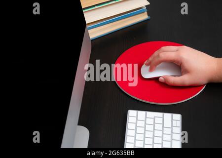 Close up of hands typing keyboard and using mouse at the office. Concept of education and working on computer. Stock Photo