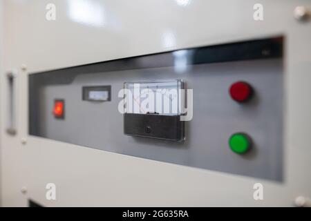 Close up of fuse box meter and switches on an industrial factory machine. Stock Photo