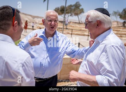 Negev, Israel. 02nd July, 2021. Federal President Frank-Walter Steinmeier (r) and Israeli President Reuven Rivlin (m) stand in the Negev Desert at the gravesite of the founder of the State of Israel, David Ben-Gurion and Paula Ben-Gurion. The German President's state visit to Israel ends after three days. Credit: Kay Nietfeld/dpa/Alamy Live News Stock Photo