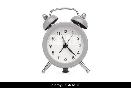 Retro analog table alarm clock with round face isolated on white background Stock Photo