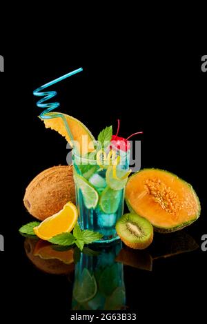 Blue Lagoon cocktail with a slice of melon and cherry isolated on white Blue Lagoon cocktail with a slice of melon and cherry isolated on white