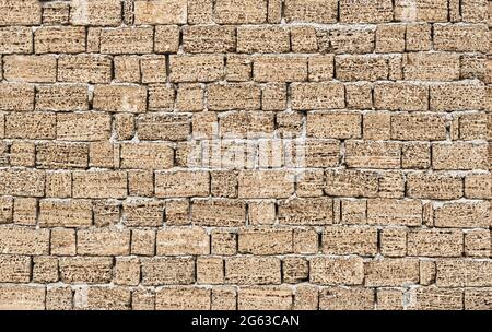 Texture of wall from a handmade brick from shell rock as background Stock Photo