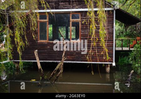 A garden shed floats above a pond in Stellenbosch, South Africa Stock Photo