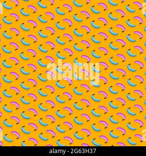 Creative pattern of colorful bananas fire extinguishers on bright orange background. Minimal food concept. Stock Photo