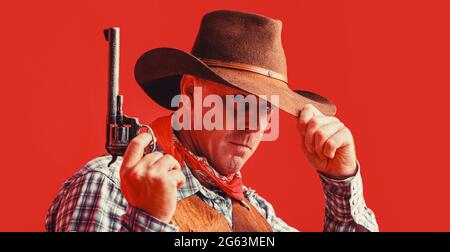 American bandit in mask, western man with hat. Man wearing cowboy hat, gun. West, guns. Portrait of a cowboy Stock Photo