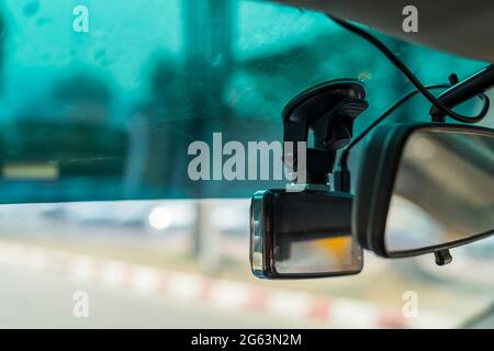 video recorder next to a rear view mirror, CCTV car camera for safety on the road accident Stock Photo