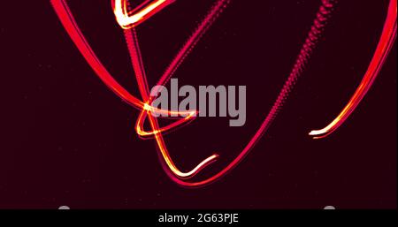 Two glowing red lines entertwining moving on a black background Stock Photo