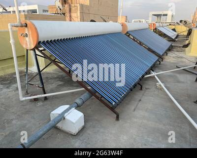 Solar panel tubes installed on roof tops to conserve energy and as alternative source of energy at Bengaluru India on 30 June 2021 Stock Photo