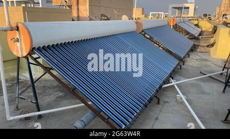 Solar panel tubes installed on roof tops to conserve energy and as alternative source of energy at Bengaluru India on 30 June 2021 Stock Photo