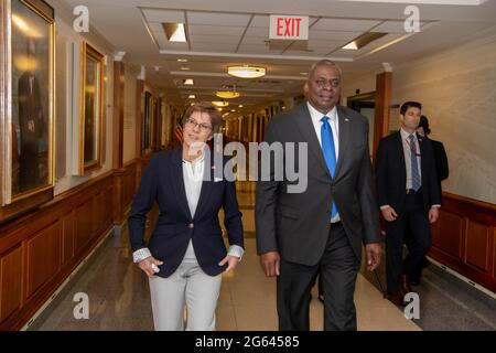 Arlington, Virginia, USA. 30th June 2021. U.S. Secretary of Defense Lloyd Austin, right, escorts German Defense Minister Annegret Kramp-Karrenbauer to their bilateral meeting at the Pentagon June 30, 2021 in Arlington, Virginia. Stock Photo