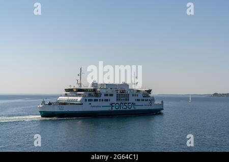 Helsingor, Denmark - 17 June 2021: the ForSea ferry making the crossing across the Oresund Strait from Denmark to Sweden Stock Photo