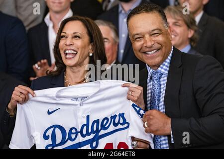 Washington, United States. 02nd July, 2021. U.S. Vice President Kamala Harris holds up a jersey presented to her by Dave Roberts, team manager of the Los Angeles Dodgers, during a ceremony in the East Room of the White House in Washington, DC on Friday, July 2, 2021. Biden is hosting the Dodgers to celebrate their 2020 World Series victory, as the administration does more large, in-person events now that coronavirus vaccination rates have increased Photo by Samuel Corum/UPI Credit: UPI/Alamy Live News Stock Photo