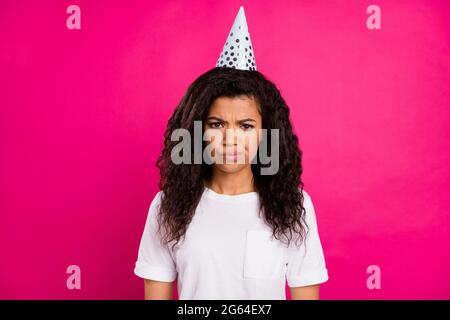 Photo of angry wavy young party lady wear cap white t-shirt isolated on pink color background Stock Photo