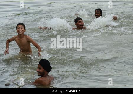 New Delhi, India. 02nd July, 2021. People jump into a canal to get some respite from scorching heat on a hot summer day in the Indian capital of New Delhi on Friday, July 2, 2021. Many parts of the country are reeling under severe heat wave. Photo by Abhishek/UPI Credit: UPI/Alamy Live News Stock Photo