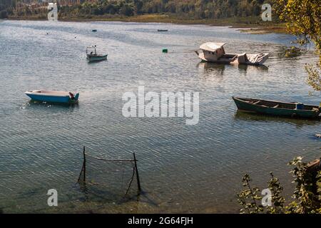 Old wrecked boats in Curaco de Velez village, Isla Quinchao island, Chile Stock Photo