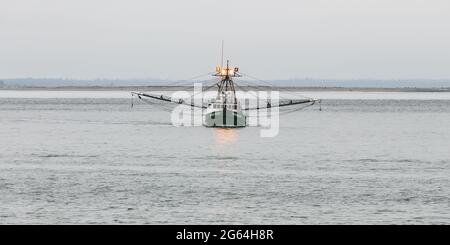 Westport, WA, USA - June 24, 2021; The fishing vessel George Allen in the water of Grays Harbor in the Pacific Northwest with its trawling equipment Stock Photo