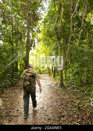 A guide walks along the trail to Actun Tunichil Maknul. Stock Photo