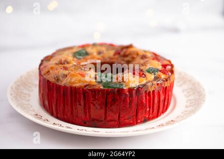 Round Fruit Cake with Cherries Pineapples and Nuts Elegant Platter Stock Photo