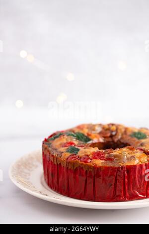 Round Fruit Cake with Cherries Pineapples and Nuts Elegant Platter Stock Photo