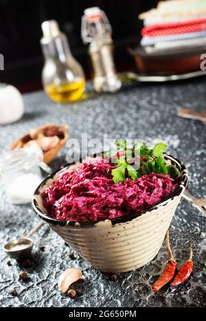 Salad of boiled beet. Beetroot salad with walnuts, eggs and sour cream in a bowl. Healthy food. Stock Photo