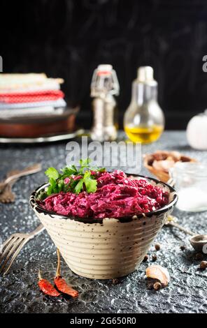 Salad of boiled beet. Beetroot salad with walnuts, eggs and sour cream in a bowl. Healthy food. Stock Photo