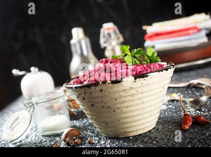 Salad of boiled beet. Beetroot salad with walnuts, eggs and sour cream in a bowl. Healthy food. Stock Photo