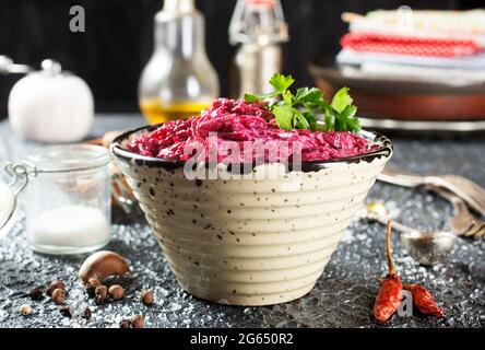 Salad of boiled beet. Beetroot salad with walnuts, eggs and sour cream in a bowl. Healthy food. Stock Photo